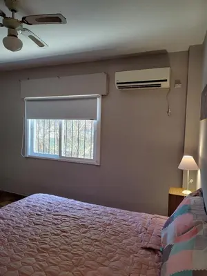 a bedroom with a bed and a window at La Mora Casa in Mina Clavero