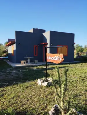 a house with a sign in front of it at EL RANCHO DE PIA in Merlo
