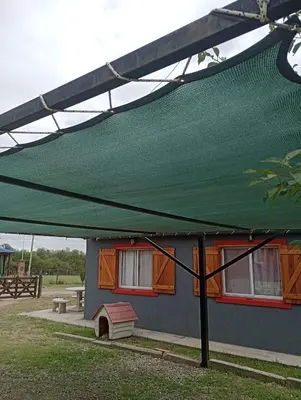 a green canopy on top of a house at EL RANCHO DE PIA in Merlo