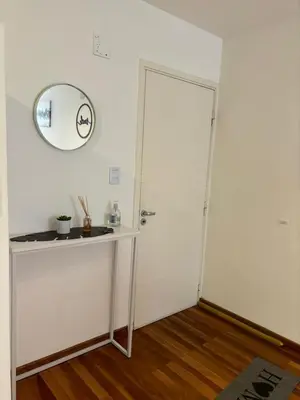 a room with a table and a mirror on the wall at Viaggiato Catamarca in Cordoba