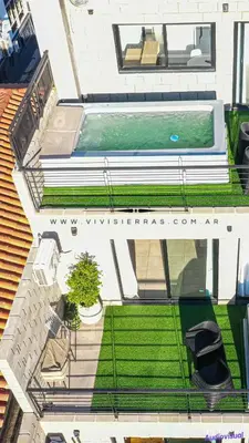 an overhead view of a swimming pool on a house at Vivisierras, Piso 4 frente al lago Centro Villa Carlos Paz, pileta privada, vista panorámica in Villa Carlos Paz