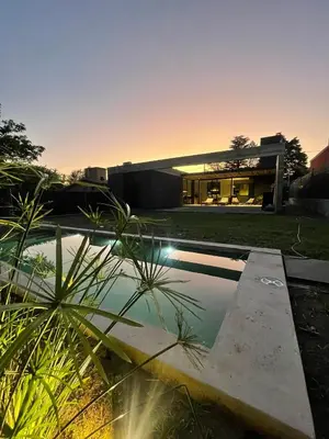 a house with a swimming pool in the yard at RumaRanch Solo Parejas Casa con pileta privada a 20 mts del Río in Villa Carlos Paz