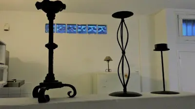 two black objects on a table in a room at Córdoba Rent Apart - Mona Suites in Cordoba