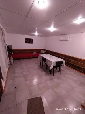 a large room with a table and chairs in it at La Cautiva 225 in Villa del Dique