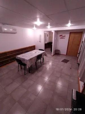 an empty room with a table and chairs in it at La Cautiva 225 in Villa del Dique