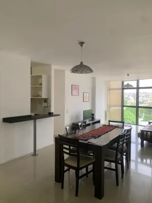 a kitchen and dining room with a table and chairs at Departamento boutiques, centrico in Villa Carlos Paz
