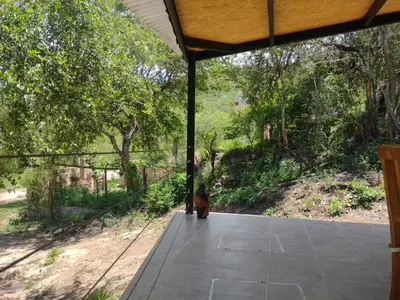 an open porch with a fire hydrant in the middle at CerroMio! in Villa Serranita