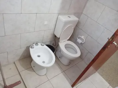 a bathroom with a toilet and a bidet at Mi Recreo in Villa Cura Brochero