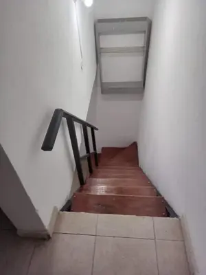 a staircase with a wooden floor and a stair railing at Mi Recreo in Villa Cura Brochero