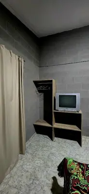 a living room with a tv and a fireplace at CASA SEN in Mina Clavero