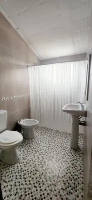 a bathroom with a toilet and a sink at CASA SEN in Mina Clavero