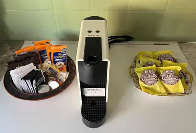 a remote control on a counter next to a basket of food at Dpto amplio y luminoso en Nva Cordoba in Cordoba