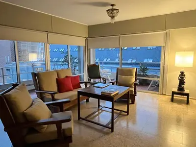 a living room with couches and a table with a table at Dpto amplio y luminoso en Nva Cordoba in Cordoba