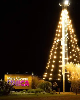 a large lit up tower with lights on it at night at ARROYO SERRANO-MINA CLAVERO in Mina Clavero