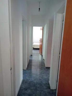 a hallway of an empty room with a bed in the distance at Mi Chalet Carlos Paz - Casa 18 in Villa Santa Cruz del Lago