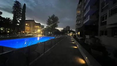 a swimming pool in a city at night at Guesthouse Luxury in Cordoba