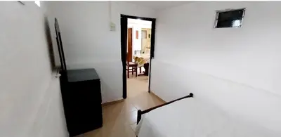a hallway with a door leading to a room at Lo de Liliana 1 in Tanti
