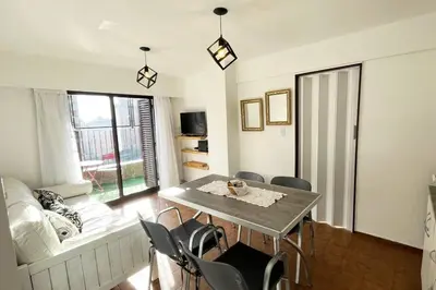 a living room with a table and chairs at Departamento en la mejor zona de Nueva Córdoba in Cordoba