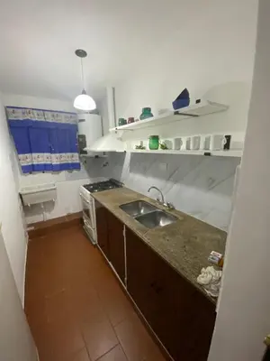 a kitchen with a sink and a counter top at departamento céntrico in Villa Carlos Paz