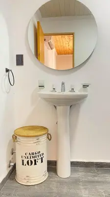 a bathroom with a sink and a mirror at Cabañas La Esperanza in Quebrada de los Pozos