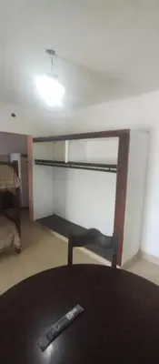 a room with a table with a remote control at Hospedaje Don Juan in Villa Dolores