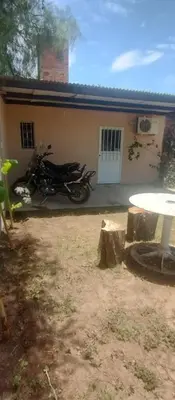 a motorcycle parked in front of a house at Hospedaje Don Juan in Villa Dolores