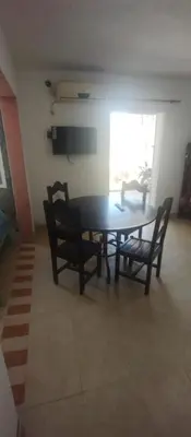 a dining room with a table and two chairs at Hospedaje Don Juan in Villa Dolores