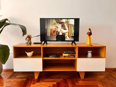 a television on a tv stand in a living room at Apartamento en Colón y Cañada in Cordoba