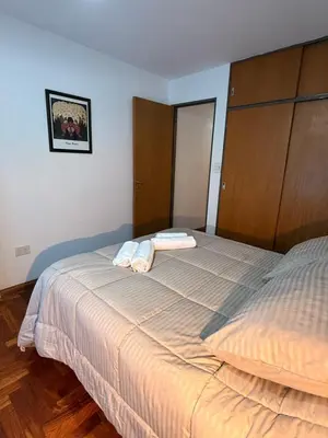a bedroom with a bed with two towels on it at Apartamento en Colón y Cañada in Cordoba