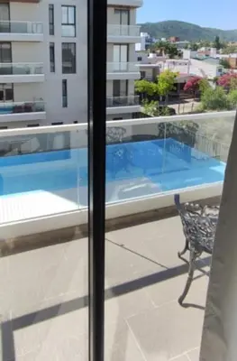 a view of a swimming pool from a balcony at Accarezza in Villa Carlos Paz