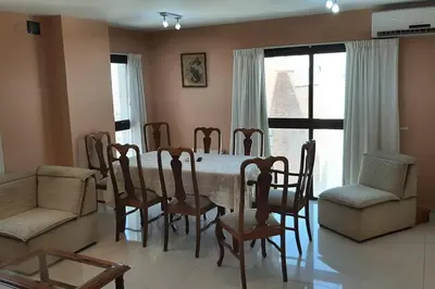 a dining room with a table and chairs at Céntrico y totalmente equipado depto en Río Cuarto in Río Cuarto