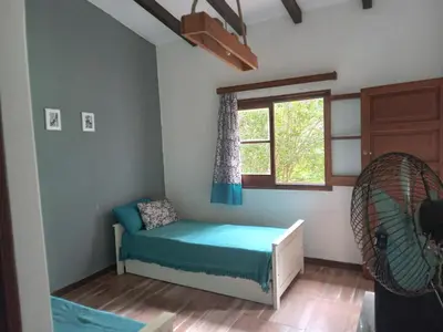 a small room with a bed and a window at Villa francisca amarilla in La Bolsa
