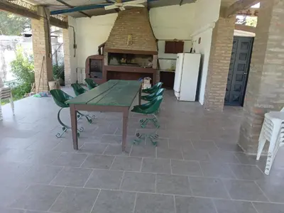 a patio with a table and chairs and a kitchen at Villa francisca amarilla in La Bolsa