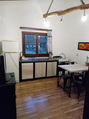 a kitchen with a counter and a table in a room at Villa francisca amarilla in La Bolsa