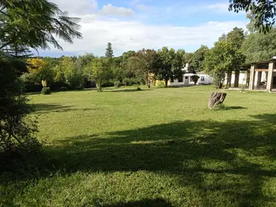 a park with a large field of grass and trees at Villa francisca amarilla in La Bolsa