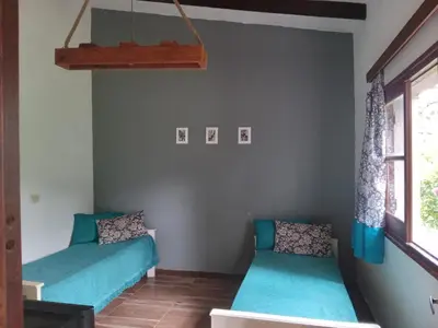 a room with two beds and a window at Villa francisca amarilla in La Bolsa