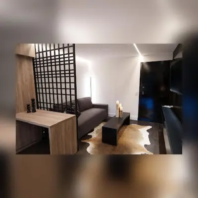 a living room with a couch and a table at Ópera Park royal life in Cordoba
