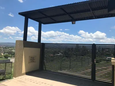 a balcony with a view of the city at Carlos Paz, Villa Santa Cruz del Lago in Villa Carlos Paz