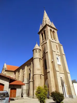 a church with a tower with a clock on it at Los Velitos in Santa Rosa del Conlara