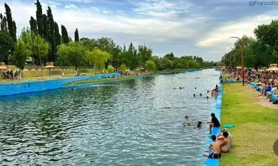 a group of people swimming in a river at Los Velitos in Santa Rosa del Conlara