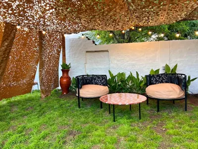 two chairs and a table under a tent at Los Velitos in Santa Rosa del Conlara