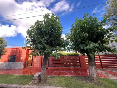 two trees in front of a house at Los Velitos in Santa Rosa del Conlara