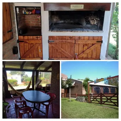a kitchen with wooden doors and a table in a backyard at Cabaña El Legado in Villa del Dique