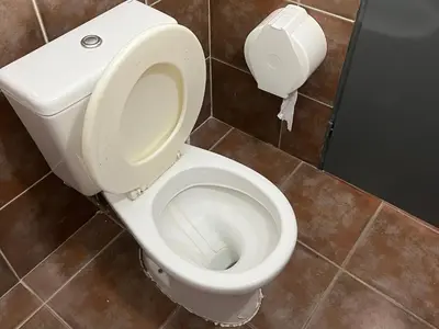 a bathroom with a white toilet in a stall at Departamento Familiar!! Excelente entorno!! (#35) in Villa Carlos Paz