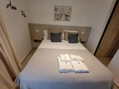 a bedroom with a bed with two towels on it at SERIETÁ 1 dormitorio con pileta y terraza in Cordoba