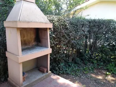 a bird house sitting on top of a patio at Casa de Campo Mama Lucia in Villa Anizacate