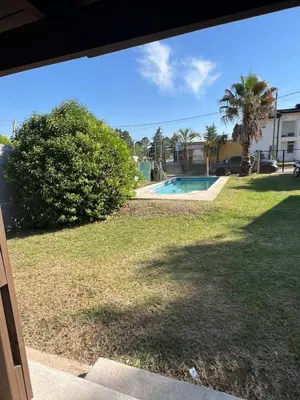 a view of a yard with a swimming pool at Casa en Potrero de Garay con pileta a 100mt Rio San Pedro in Potrero de Garay