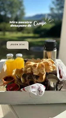 a tray of food on a table with food at La Jacinta posada suites in Santa Rosa de Calamuchita