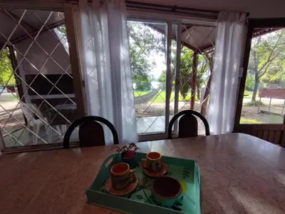 a table with a plate with two cups on it at La Cabañita Córdoba in Villa Rumipal