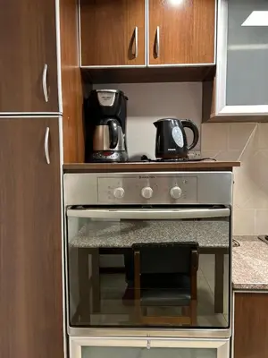 a stove in a kitchen with a coffee pot on top at Casa YO in Cordoba